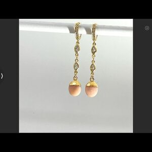 Gold huggie hoops with genuine peach moonstone charms on drop dangle earrings